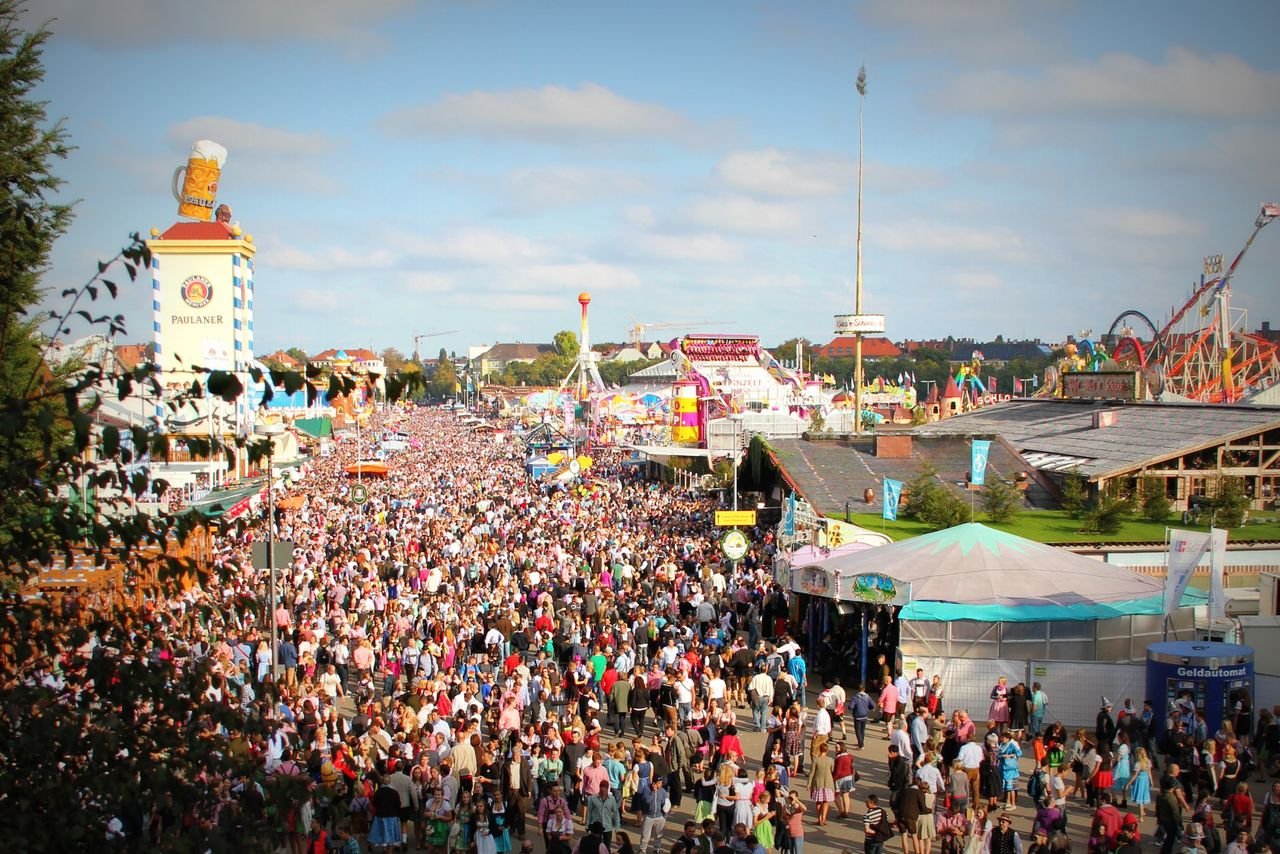 Massive crowd filling the Theresienwiese fairground at Oktoberfest in Munich